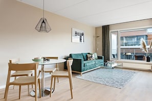 Superior Apartment, 3 bedrooms | Living area | 42-inch flat-screen TV with digital channels, TV