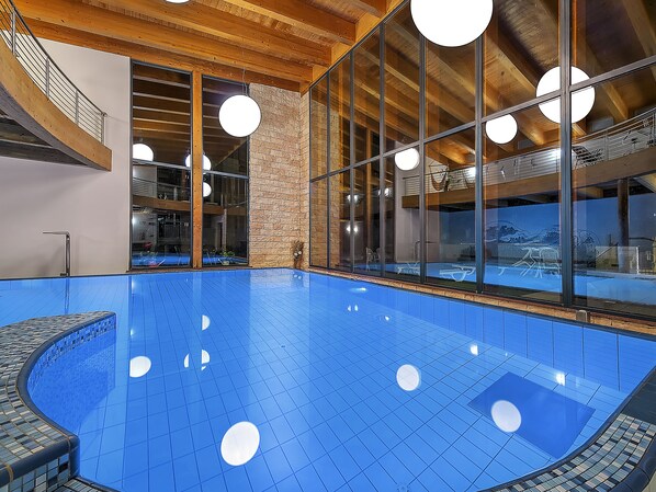 Indoor pool, open 2:00 PM to 8:00 PM, pool loungers