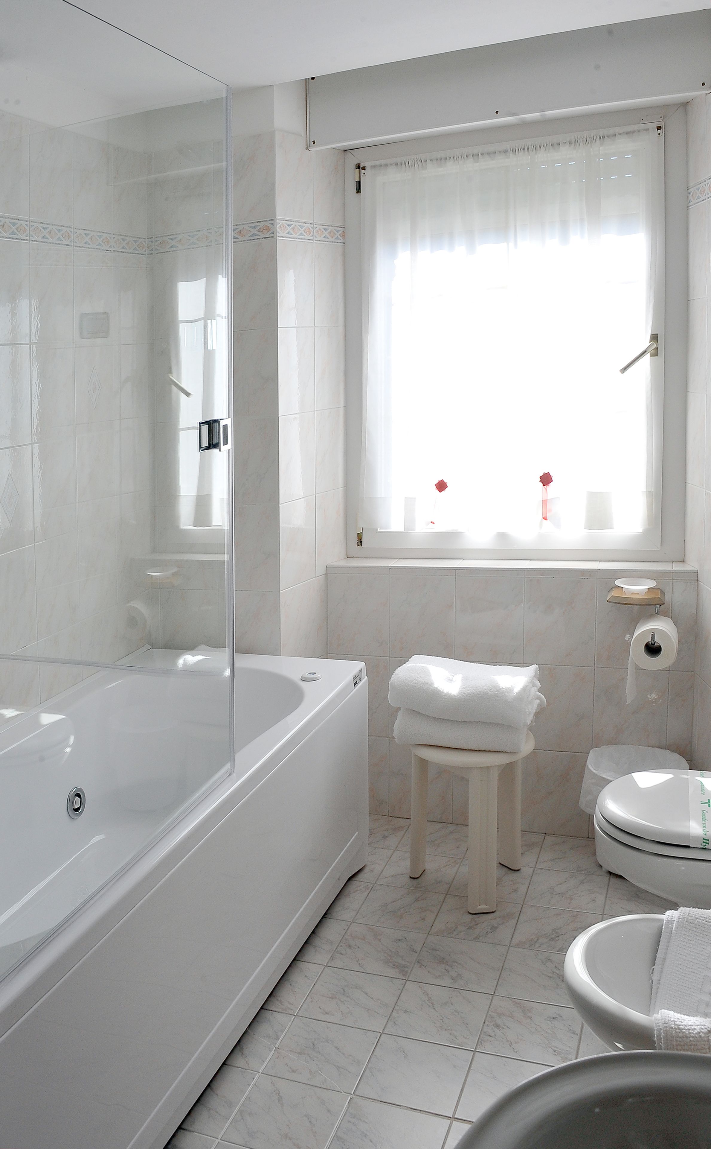 junior suite | bathroom | rainfall showerhead, free toiletries, hair dryer, bathrobes