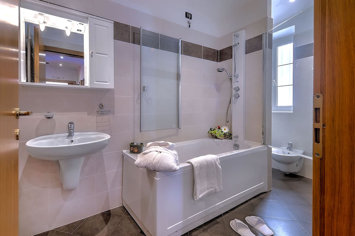 suite | bathroom | rainfall showerhead, free toiletries, hair dryer, bathrobes