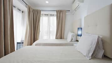 Twin Room, Private Bathroom | In-room safe, individually decorated, blackout drapes