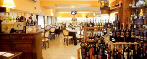 Breakfast, lunch, dinner served; local cuisine, al fresco dining