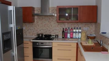 Apartment, 2 Bedrooms, Kitchen | Private kitchen | Full-size fridge, coffee/tea maker, cookware/dishes/utensils