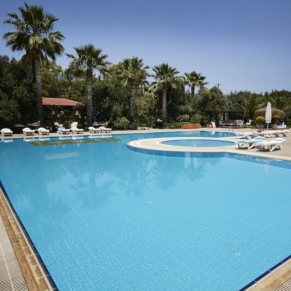 Outdoor pool, open 9:00 AM to 8:00 PM, sun loungers