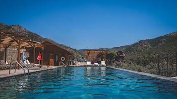 Seasonal outdoor pool, pool umbrellas, pool loungers