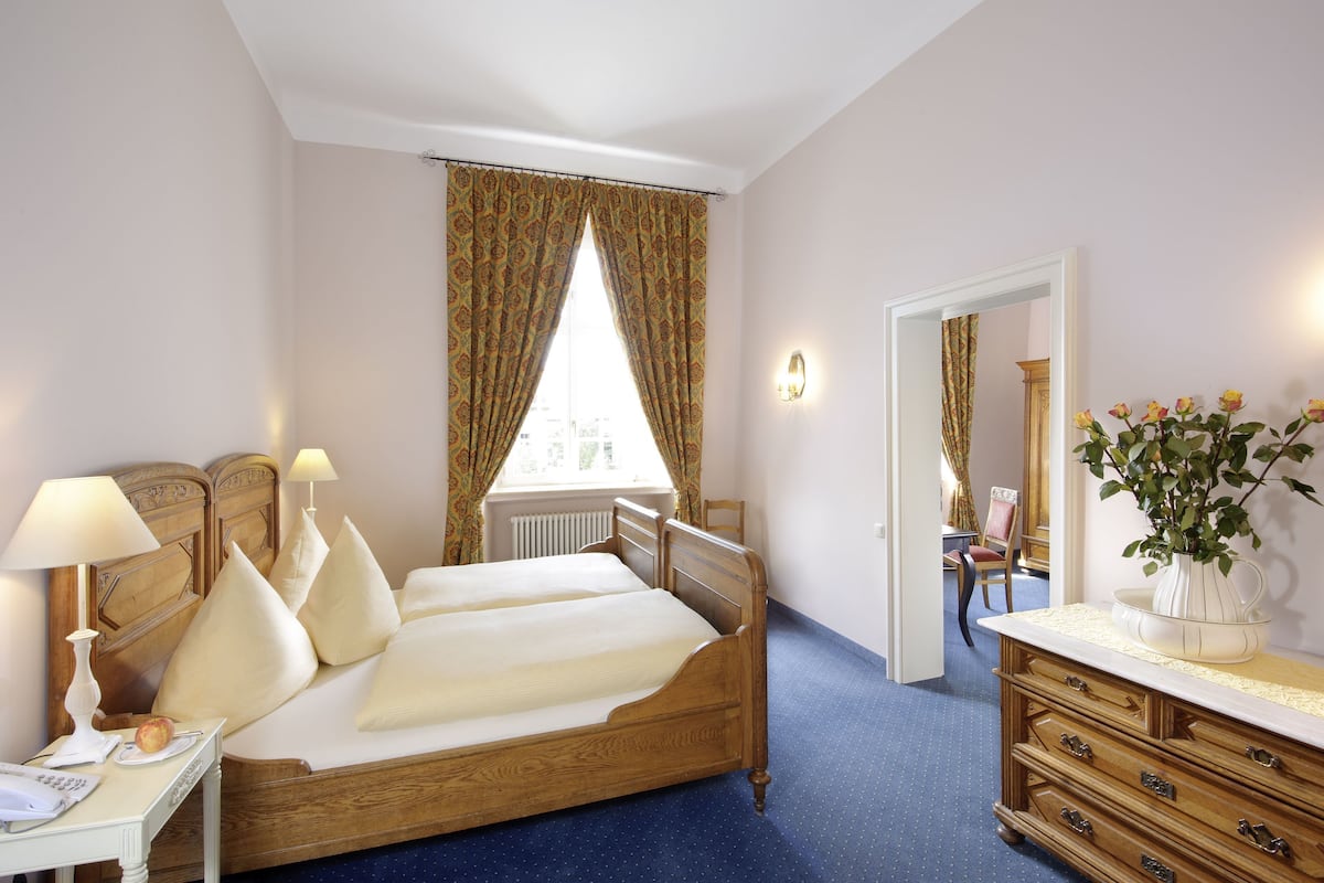 junior suite | in-room safe, individually decorated, individually furnished, desk
