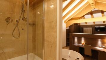Suite | Bathroom | Jetted tub, rainfall showerhead, free toiletries, hair dryer