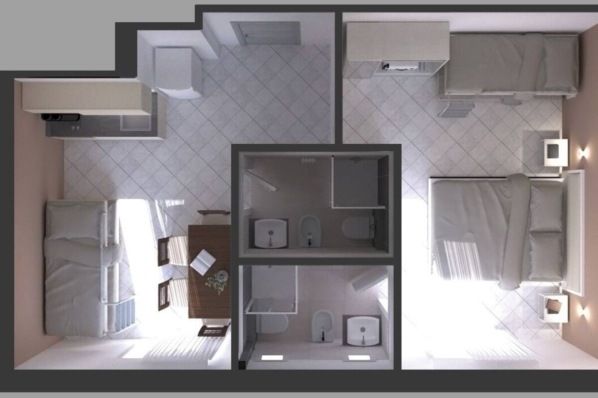 A floor plan of a hotel room with a kitchenette, a bathroom, a bed, and a seating area.