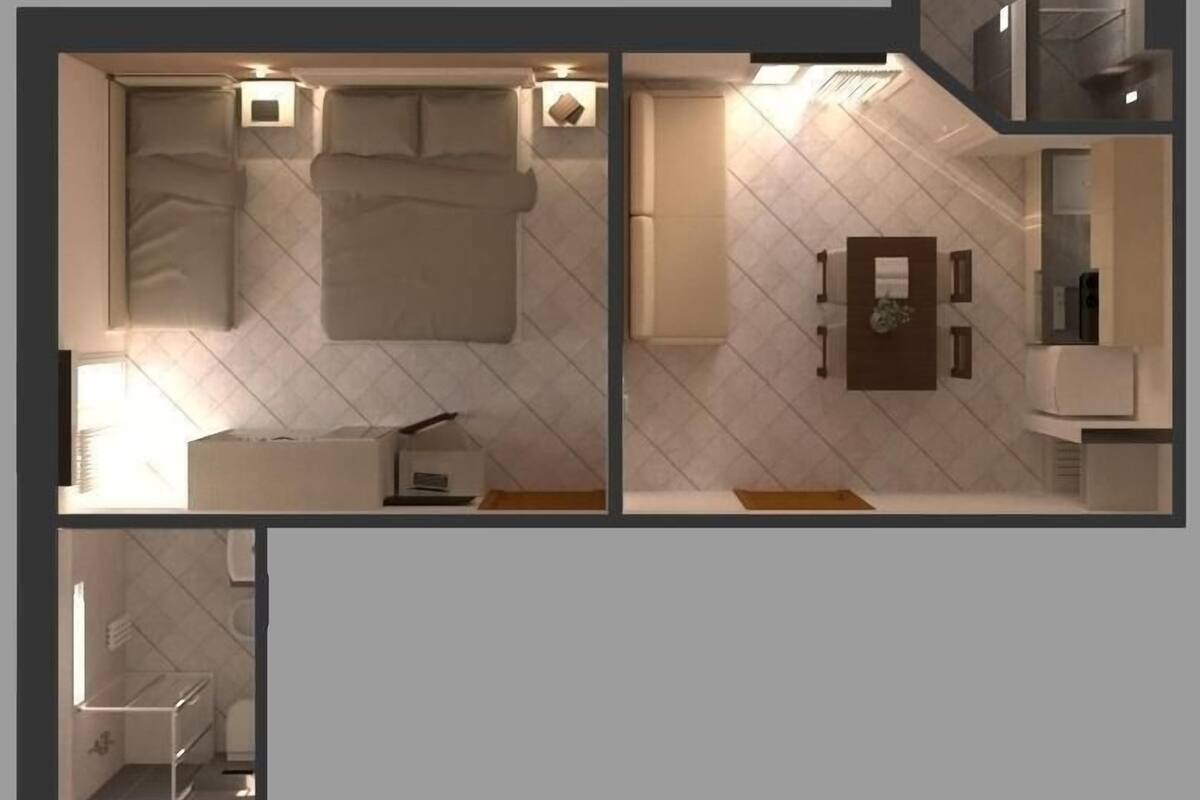 A bedroom with a bed, bedside tables, and a nightstand.