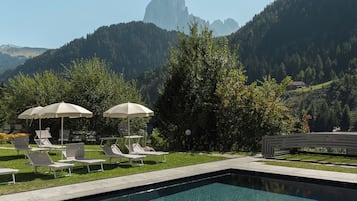 Indoor pool, outdoor pool, pool umbrellas, pool loungers