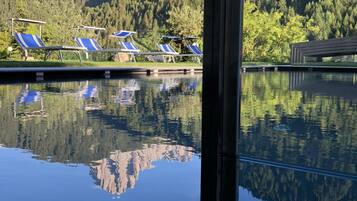 Indoor pool, outdoor pool, pool umbrellas, pool loungers