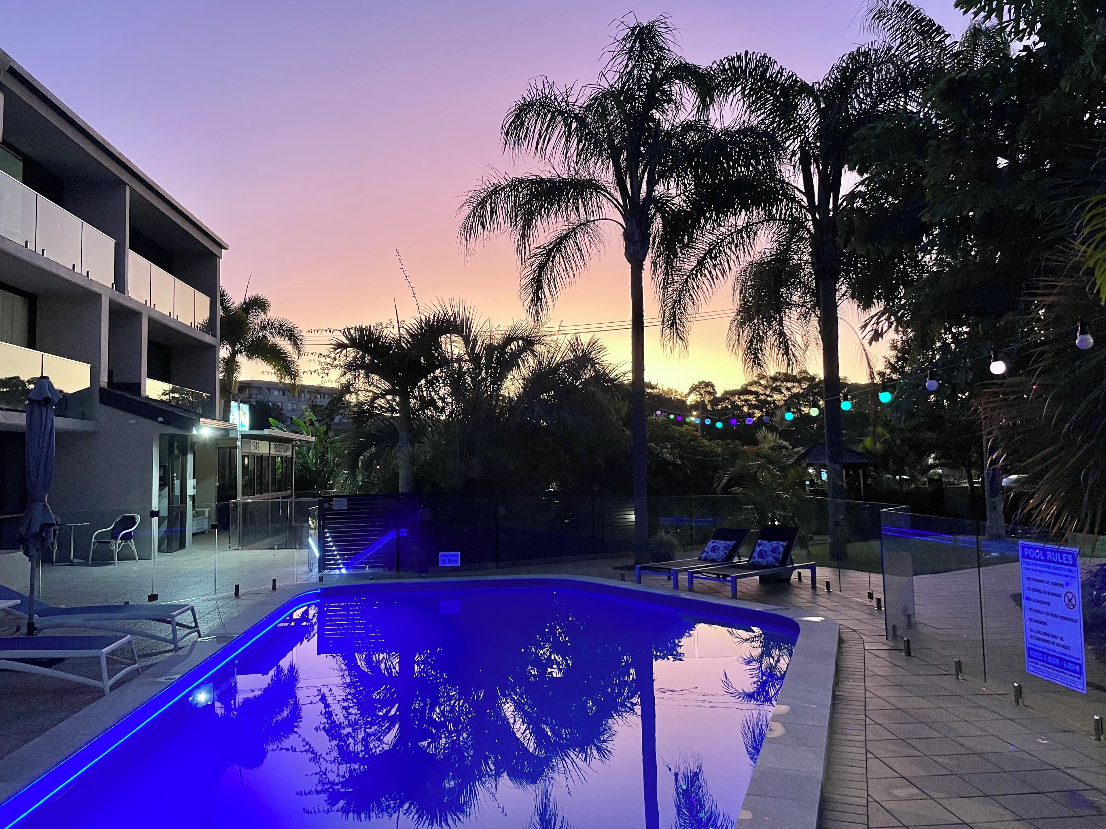 Outdoor pool, a heated pool, pool umbrellas, pool loungers