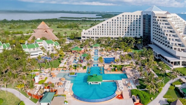 A resort with multiple swimming pools, a large hotel building, and a pyramid-shaped structure. - Iberostar Selection Cancún - All Inclusive (Cancun)