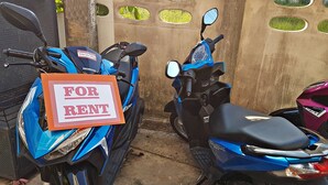 Two blue motorcycles parked next to each other with a sign indicating they are for rent. - Green Harbor Hotel & Service Apartment (Patong)