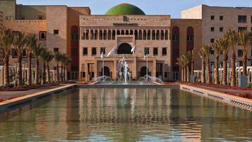 Seasonal outdoor pool, open 10:00 AM to 8:00 PM, pool umbrellas