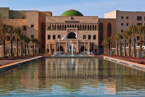 Outdoor pool, open 10:00 AM to 8:00 PM, pool umbrellas