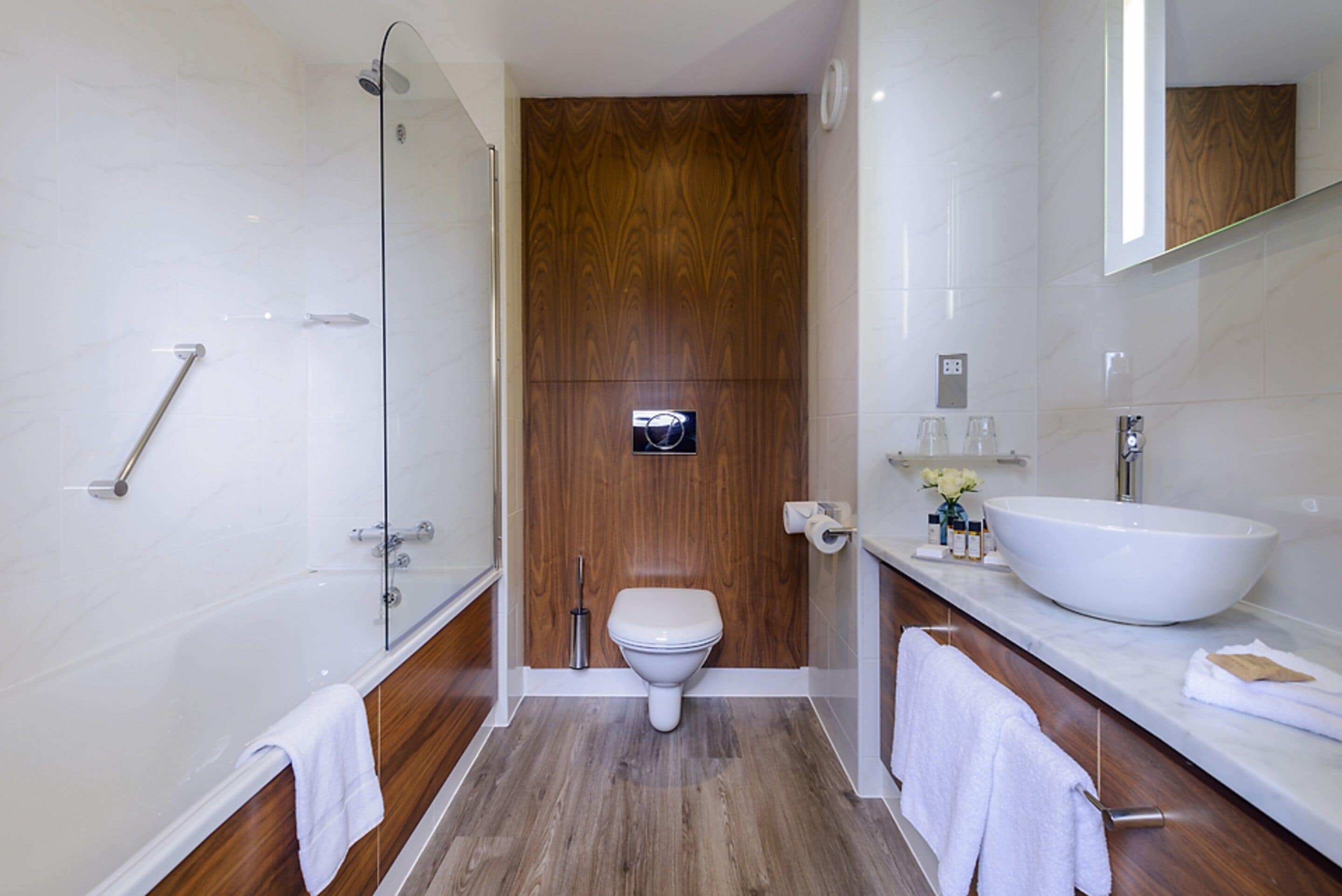 designer toiletries, hair dryer, towels