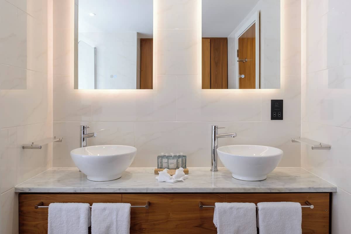 executive suite | bathroom | designer toiletries, hair dryer, towels
