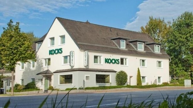 A two-story hotel named 'KOCKS' with a modern design, featuring a prominent 'HOTEL' sign on the facade. - Kocks Hotel (Hamburg)