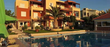 Indoor pool, open 10:00 AM to 8:00 PM, pool umbrellas, pool loungers