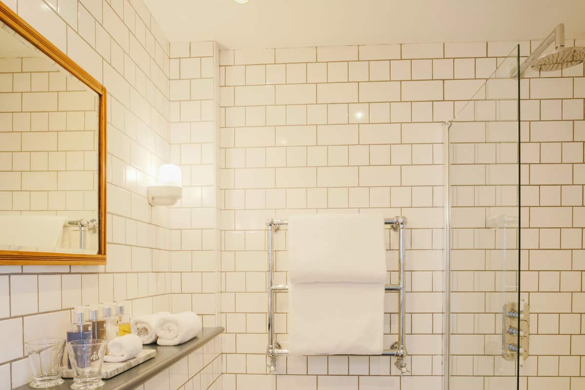 room, 1 king bed | bathroom | shower, rainfall showerhead, designer toiletries, hair dryer