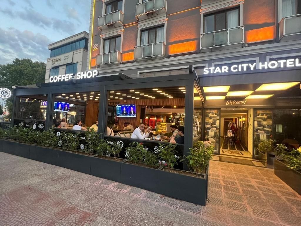 A Star City Hotel with a coffee shop and restaurant seating area.