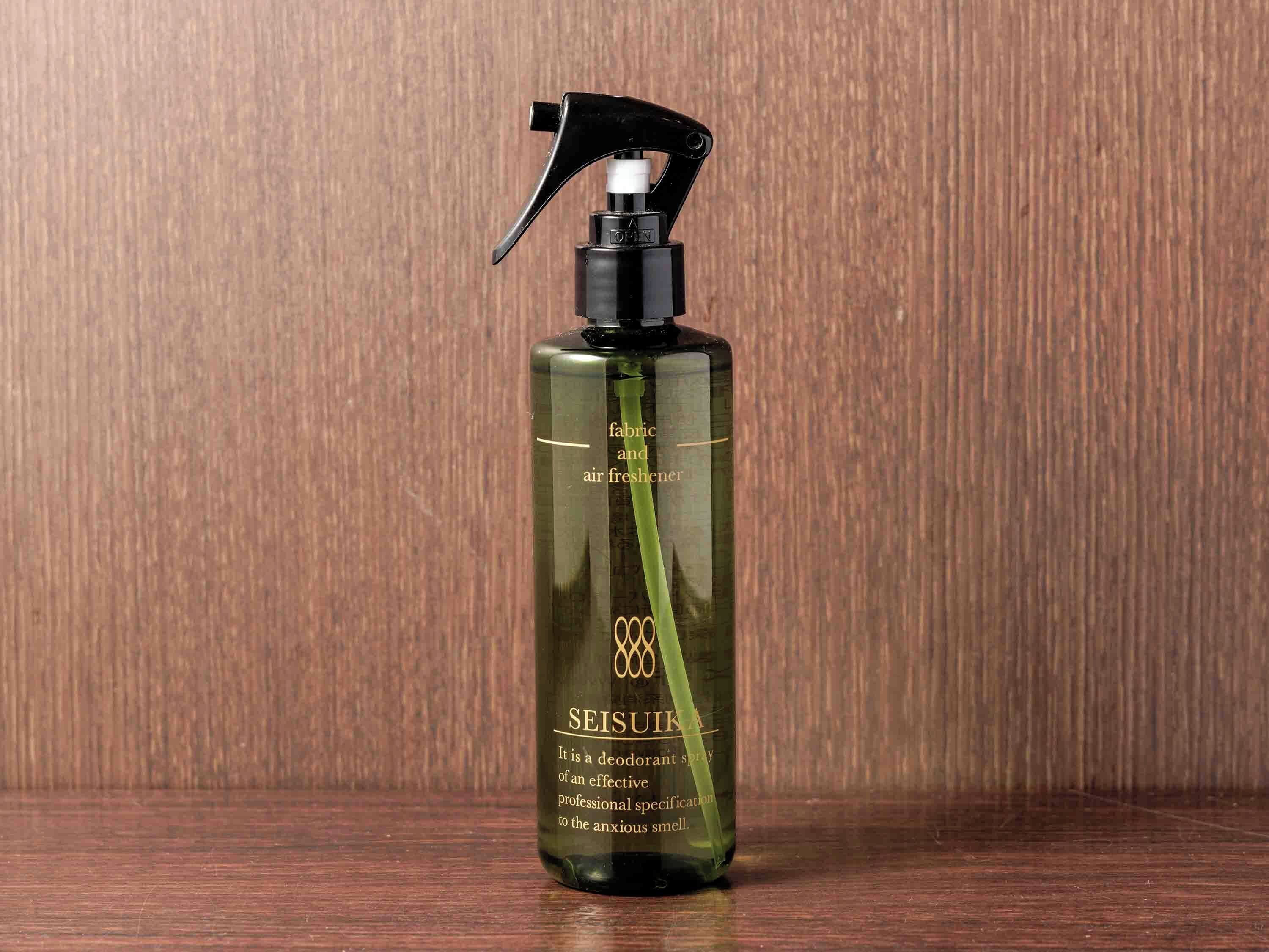 A bottle of Seisuiika air freshener on a wooden surface.