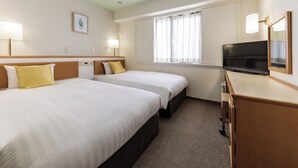 A hotel room with two beds, a TV, and a window with curtains. - Nishitetsu Inn Tenjin (Fukuoka)