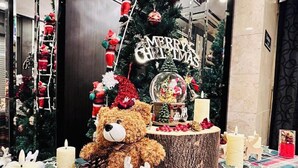 A Christmas-themed display with a teddy bear, a Christmas tree, and a 'Merry Christmas' sign. - Nishitetsu Inn Shinsaibashi (Osaka)