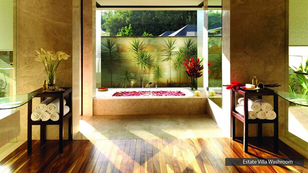 A modern washroom with a large window, wooden flooring, and a view of greenery outside. - The Serai Chikmagalur (Chikkamagaluru)