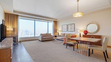 Suite, 1 lit double, en angle | Coin séjour