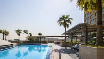 Outdoor pool, pool umbrellas, sun loungers