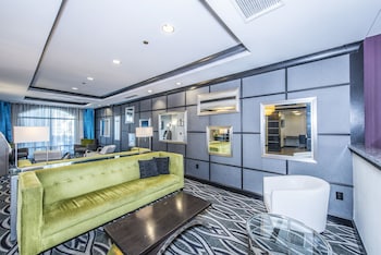 Sitting area in hotel lobby at Holiday Inn Express & Suites Charleston Arpt-Conv Ctr Area