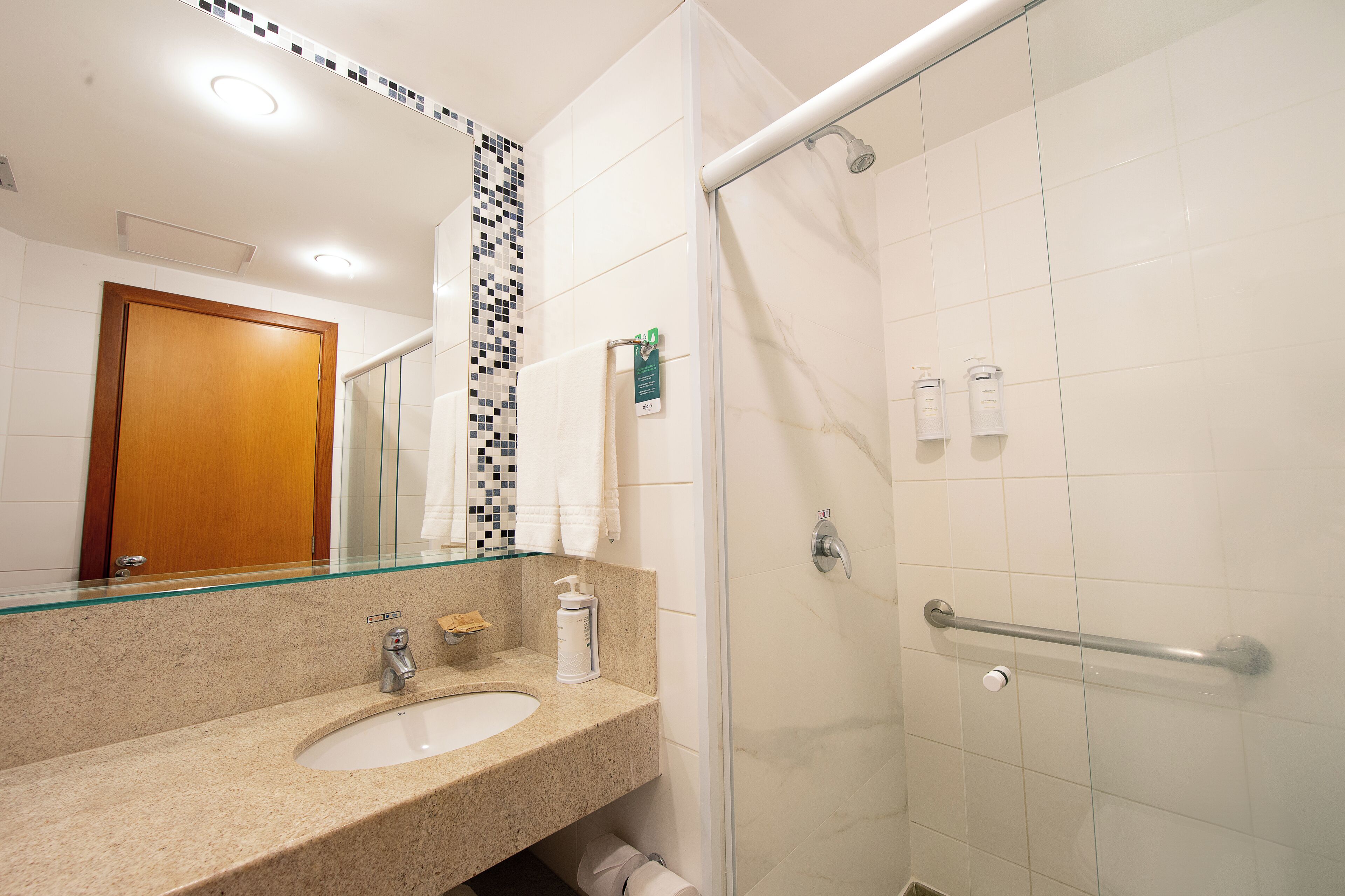 shower, designer toiletries, hair dryer, towels