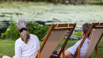Relax by the serene water's edge in a tranquil setting.