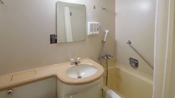 Combined shower/tub, free toiletries, hair dryer, slippers