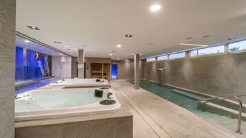 Relax in our serene spa area, featuring two hot tubs and a tranquil atmosphere.