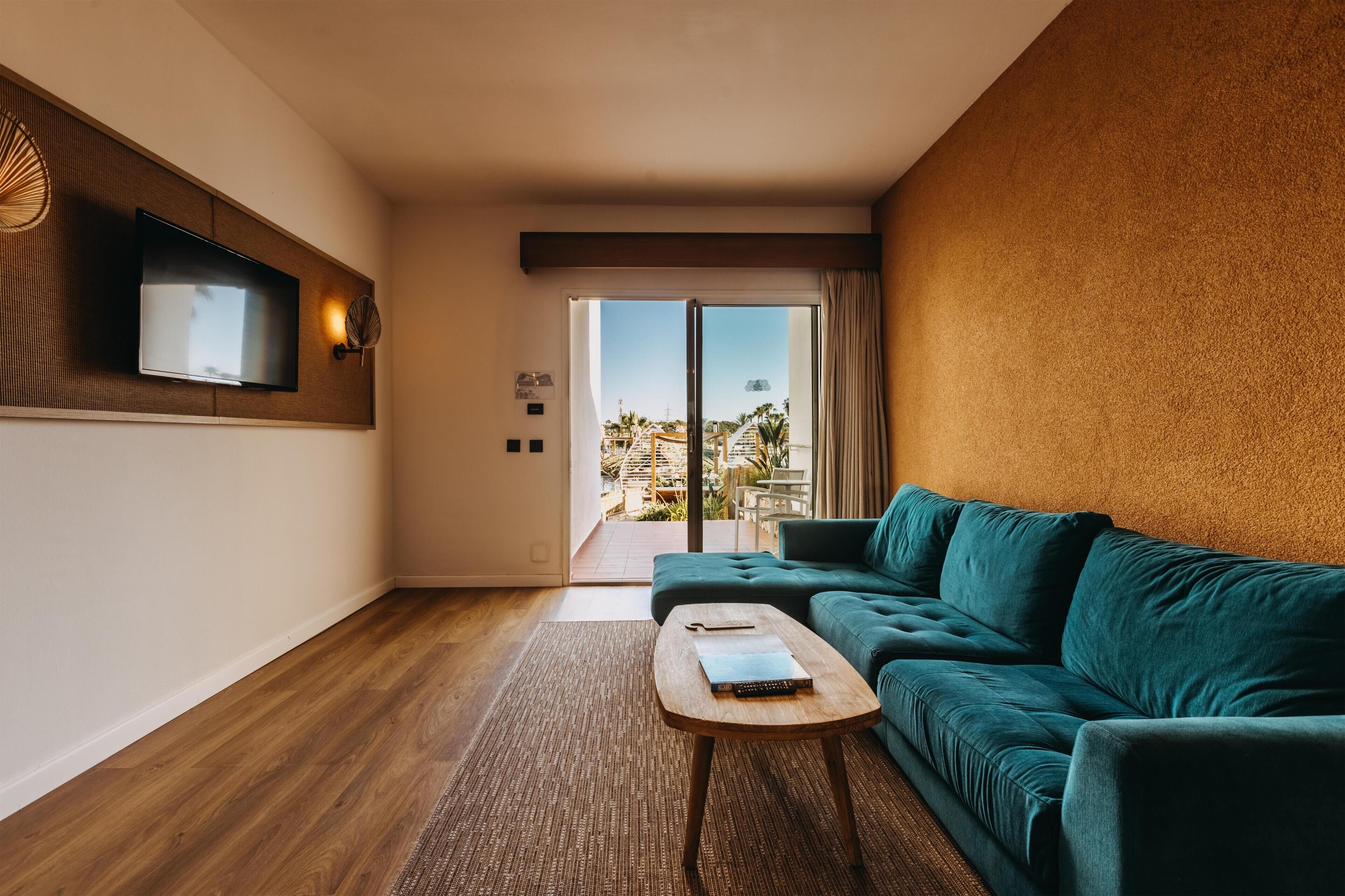 Suite, Balcony, Pool View | Minibar, in-room safe, blackout drapes, soundproofing