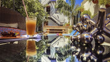 Outdoor pool, open 8 AM to 10 PM, pool loungers