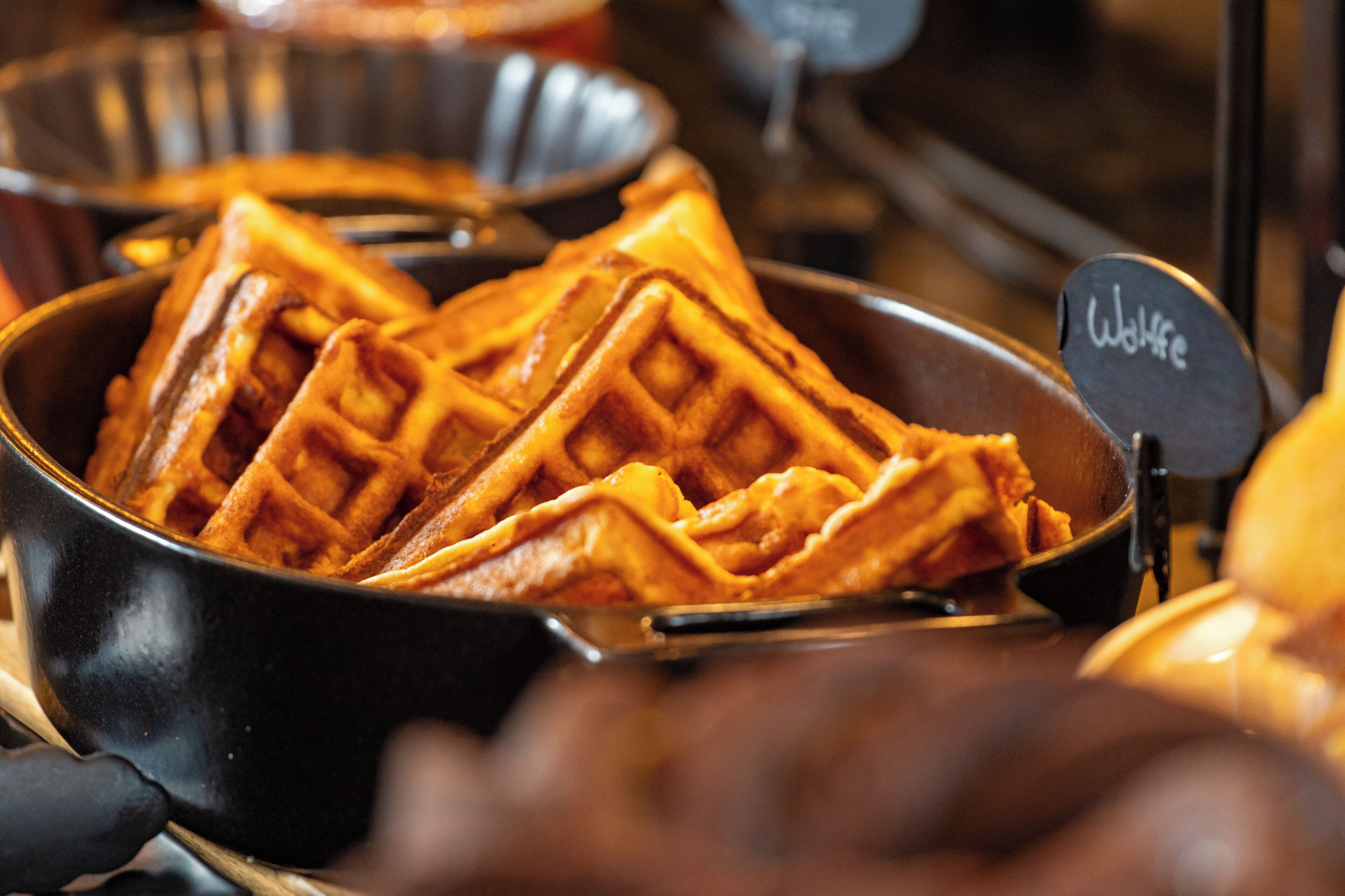 A close-up of a waffle with a sign indicating 'Waffle.'