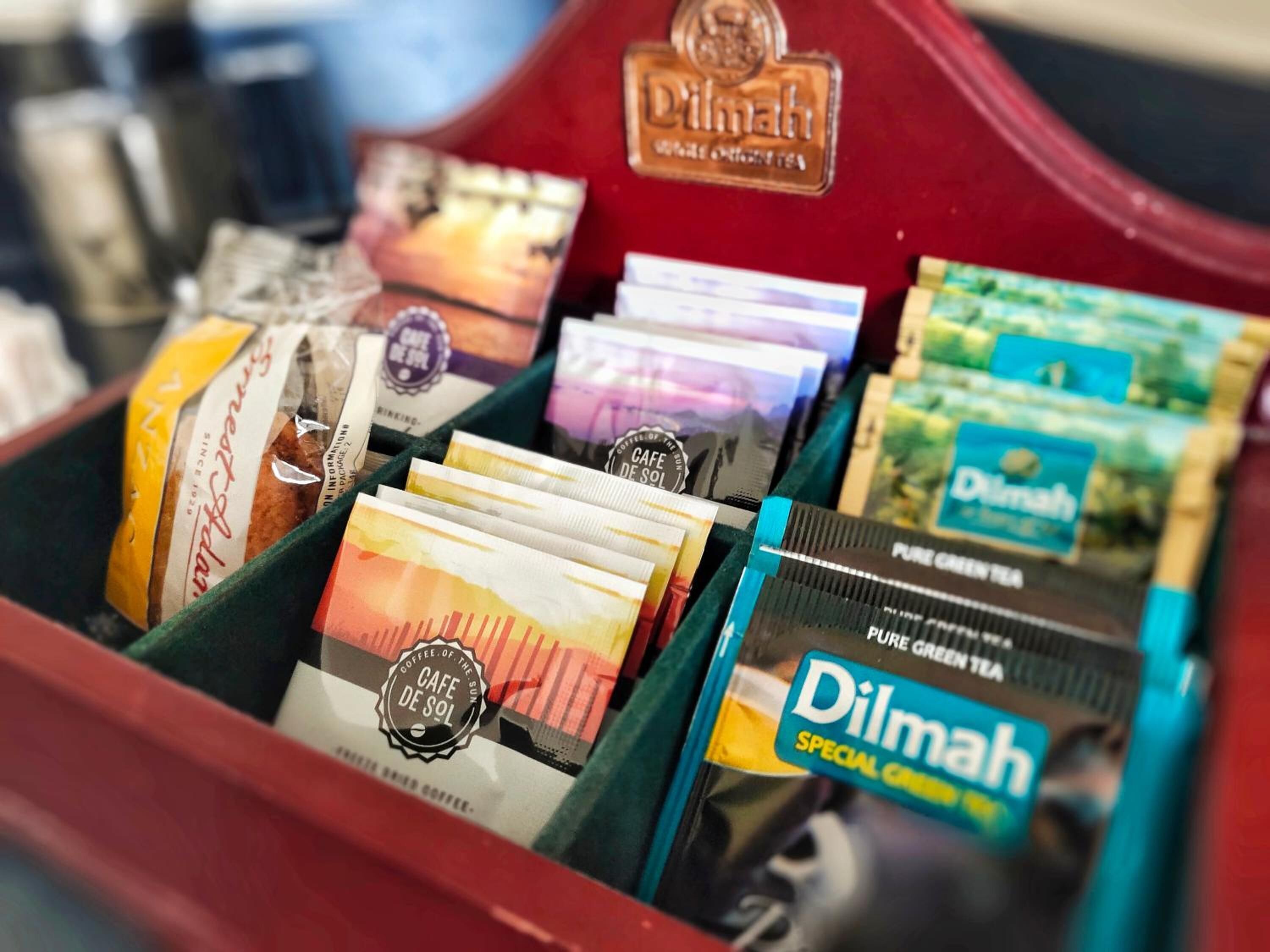 A display of various coffee and tea products in a red box.