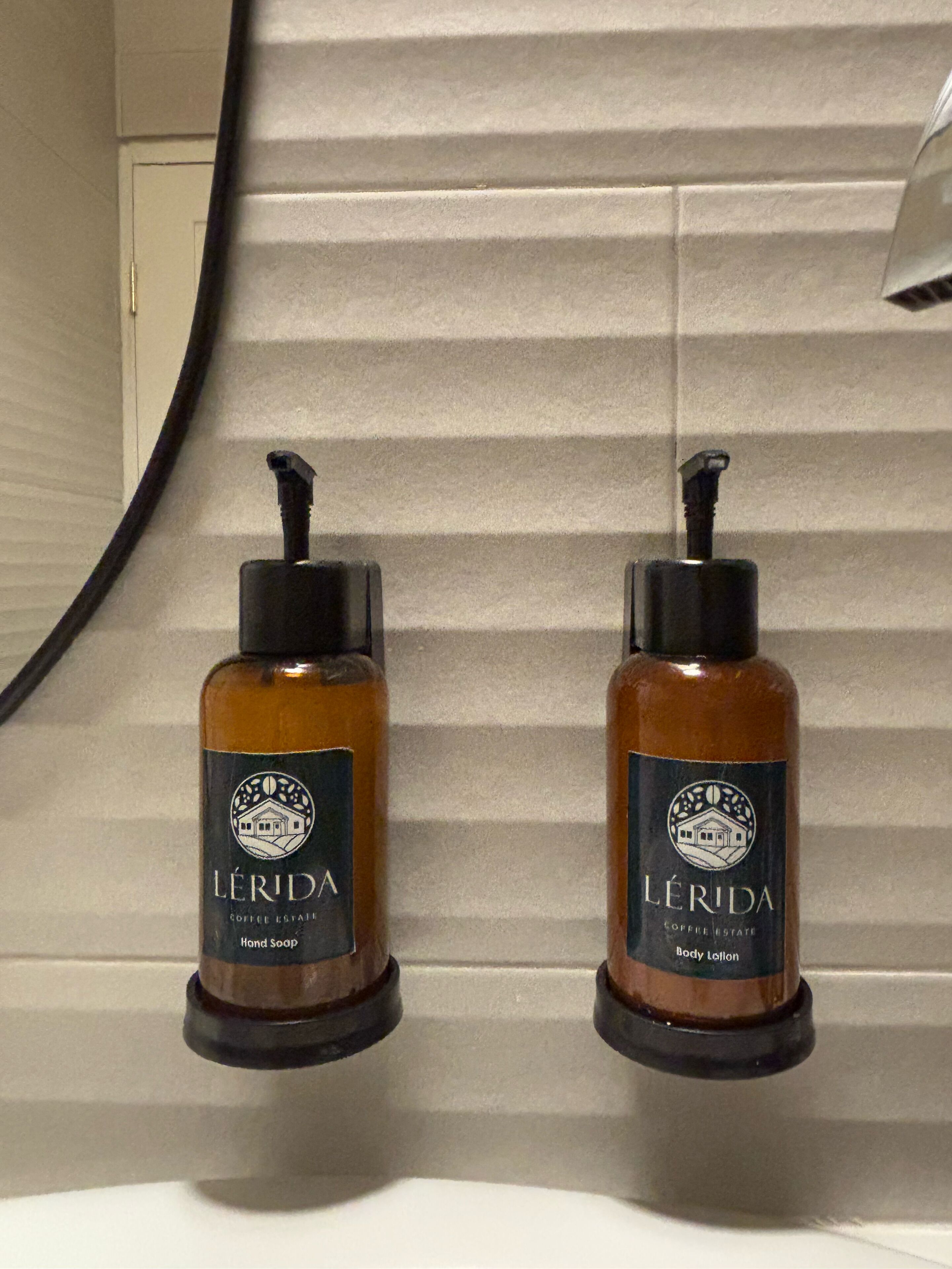 rainfall showerhead, designer toiletries, hair dryer, towels