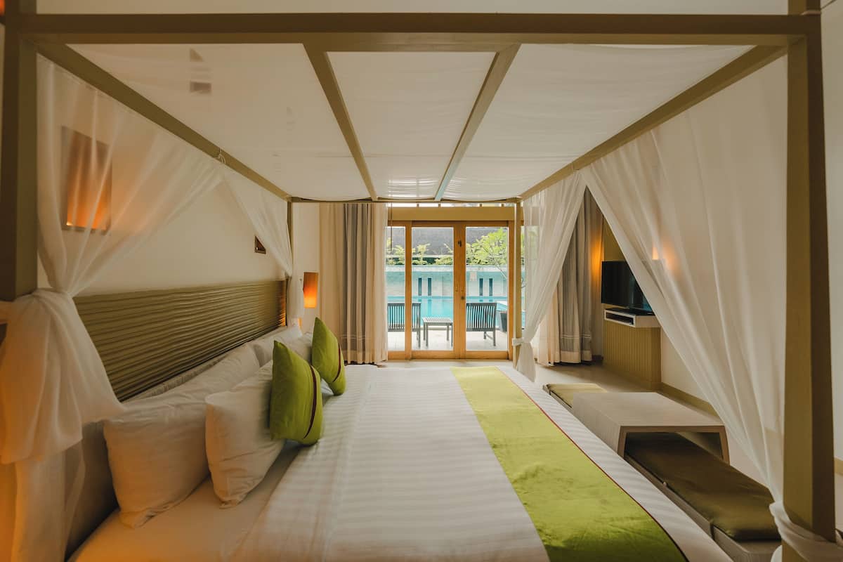 Deluxe Room, 1 King Bed, Pool Access | In-room safe, individually furnished, desk, rollaway beds