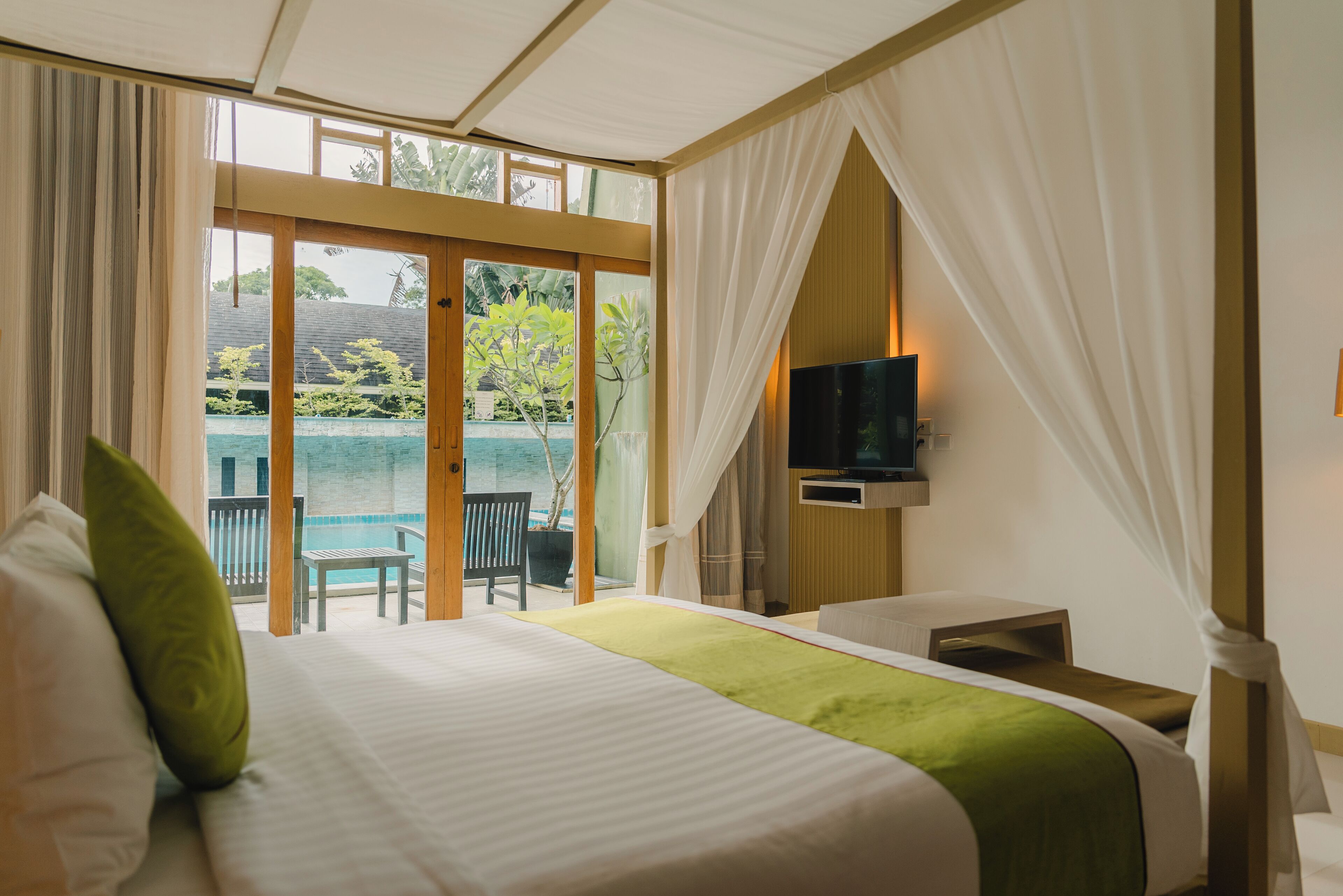 Deluxe Room, 1 King Bed, Pool Access | In-room safe, individually furnished, desk, rollaway beds