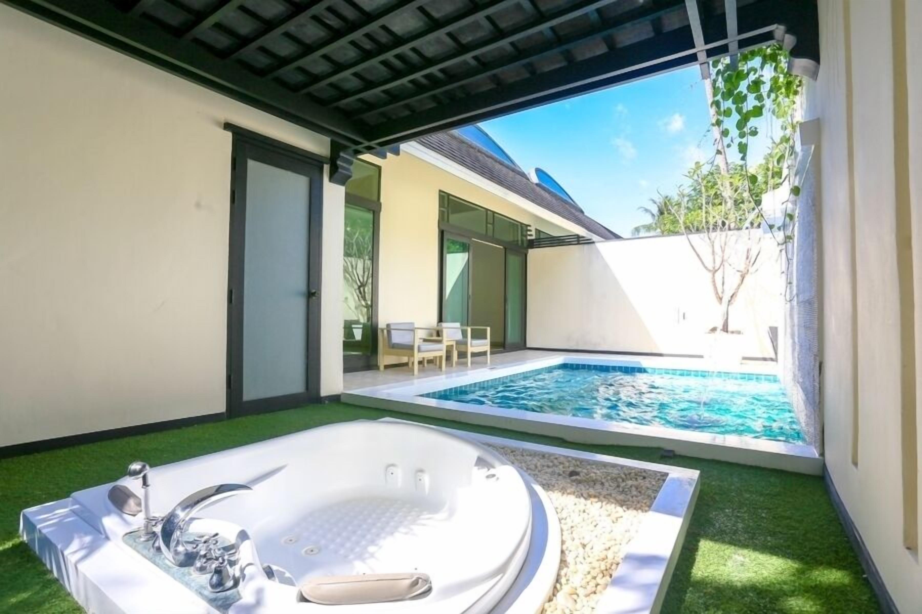 A private outdoor pool area with a hot tub and a small pool.