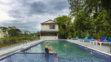 Outdoor pool, open 6:00 AM to 10:00 PM, pool umbrellas, sun loungers