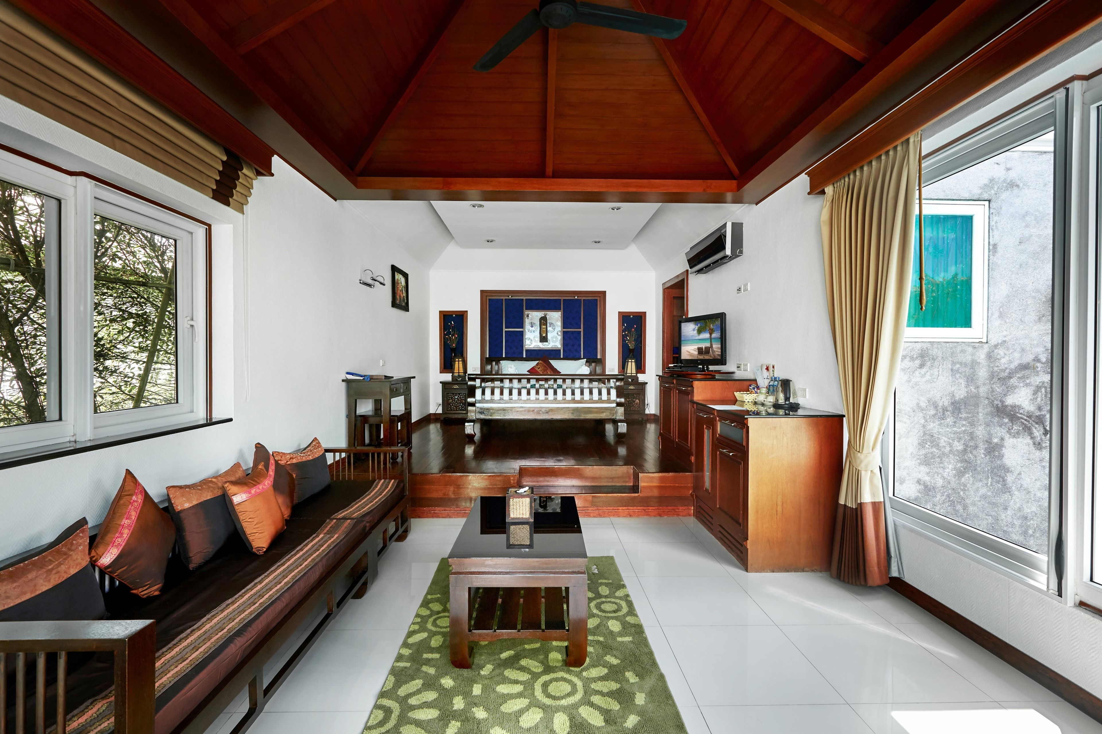 family villa, private pool | living area | 32-inch tv with cable channels, fireplace, dvd player