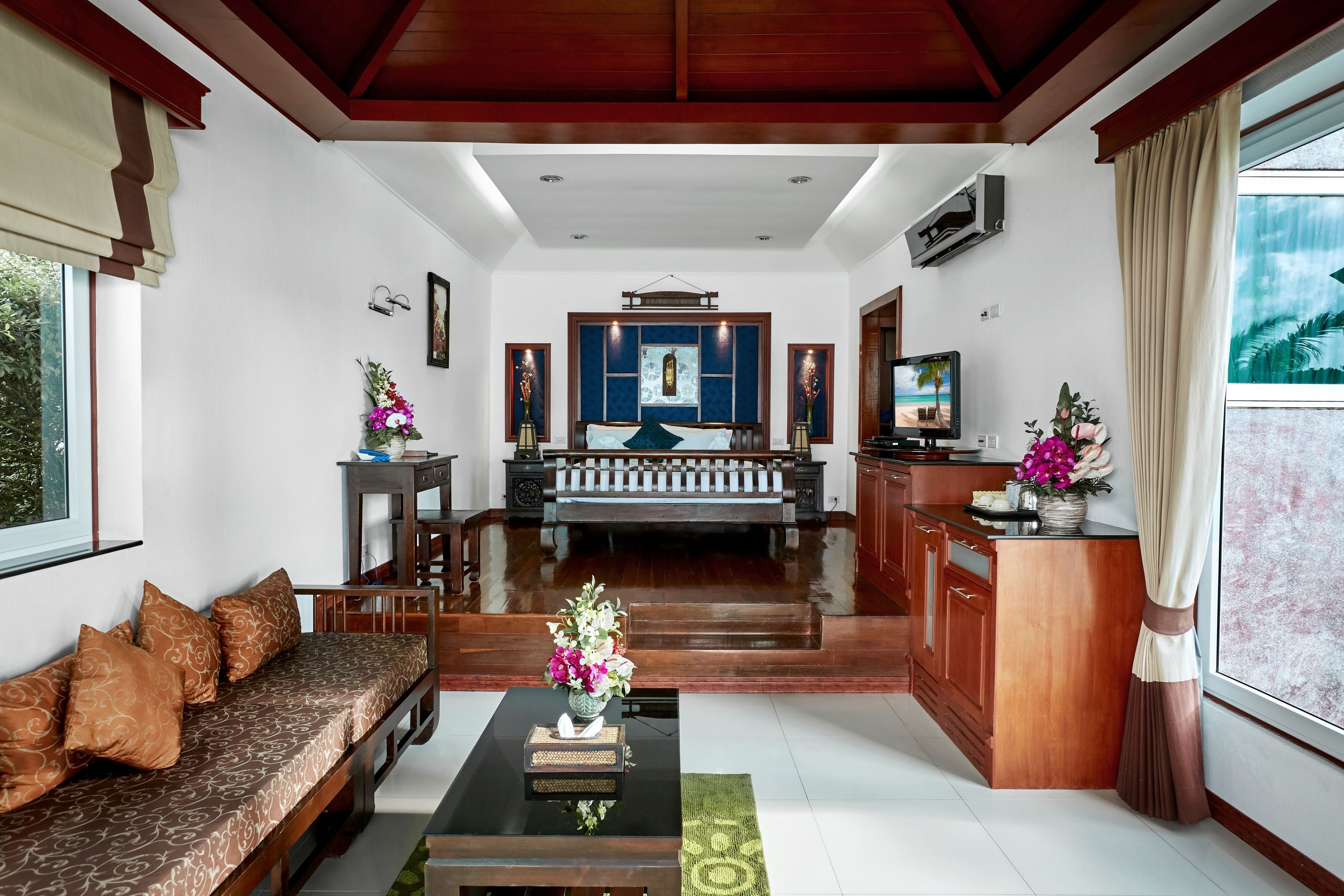 beachfront pool villa | living area | 32-inch tv with cable channels, fireplace, dvd player