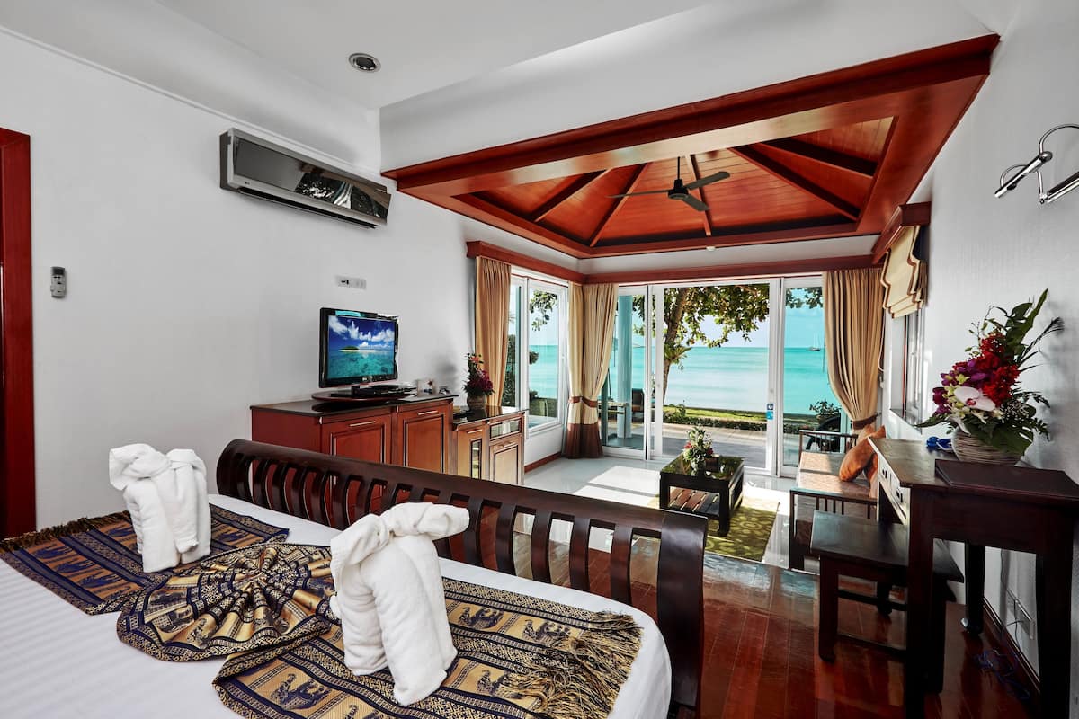 beachfront pool villa | living area | 32-inch tv with cable channels, fireplace, dvd player