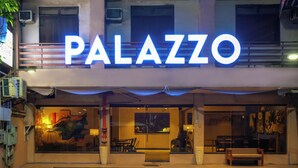 A building with a prominent "PALAZZO" sign.